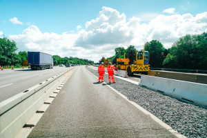 Two road engineers discussing the next steps in installing Multibloc TVCB on the M6 J16-19