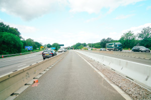 Distant shot of Multibloc TVCB installed on the motorway with vehicles driving past